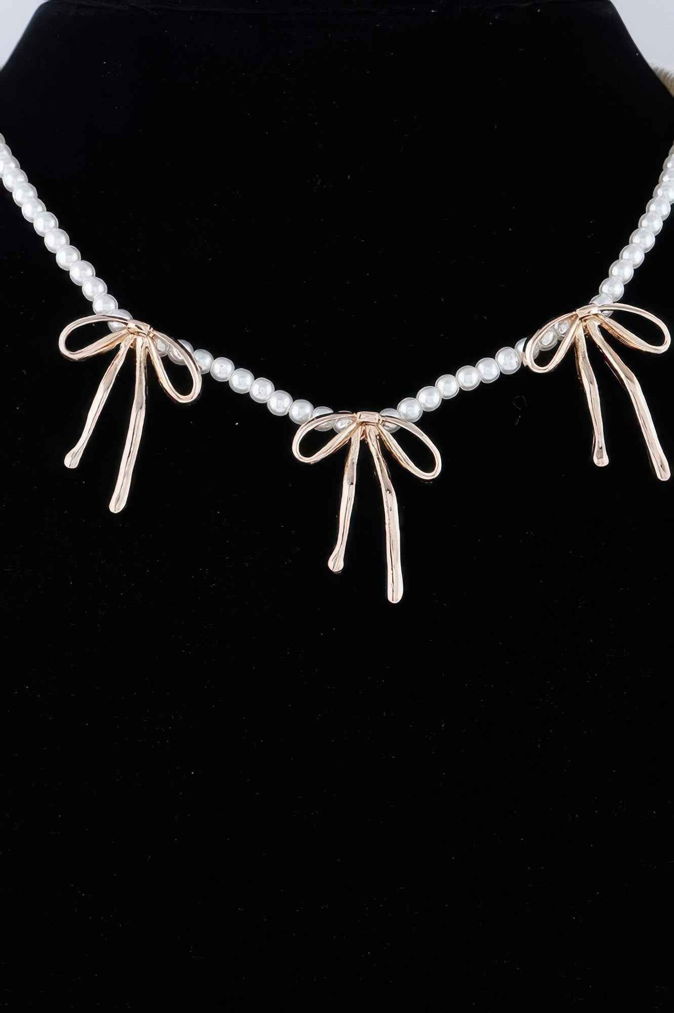 Pearl And Metal Ribbon Charm Necklace