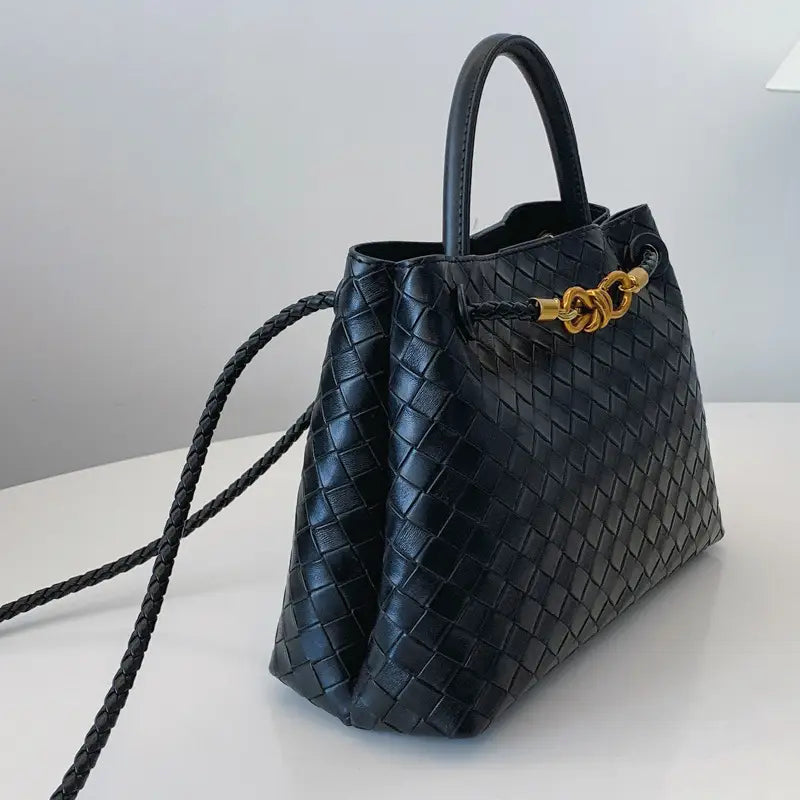 Metal rope buckle woven shoulder bag fashionable versatile retro commuter bag for women.