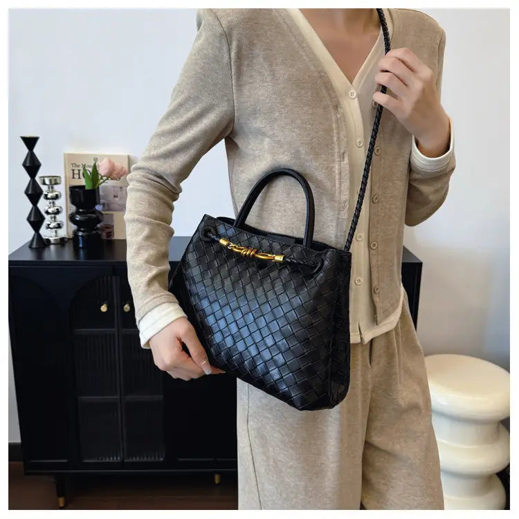 Metal rope buckle woven shoulder bag fashionable versatile retro commuter bag for women.