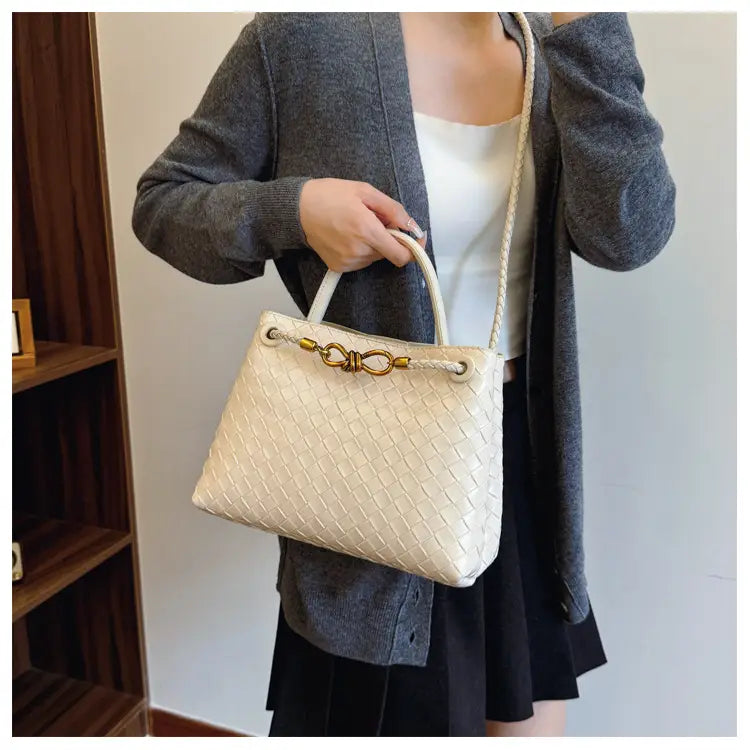 Metal rope buckle woven shoulder bag fashionable versatile retro commuter bag for women.