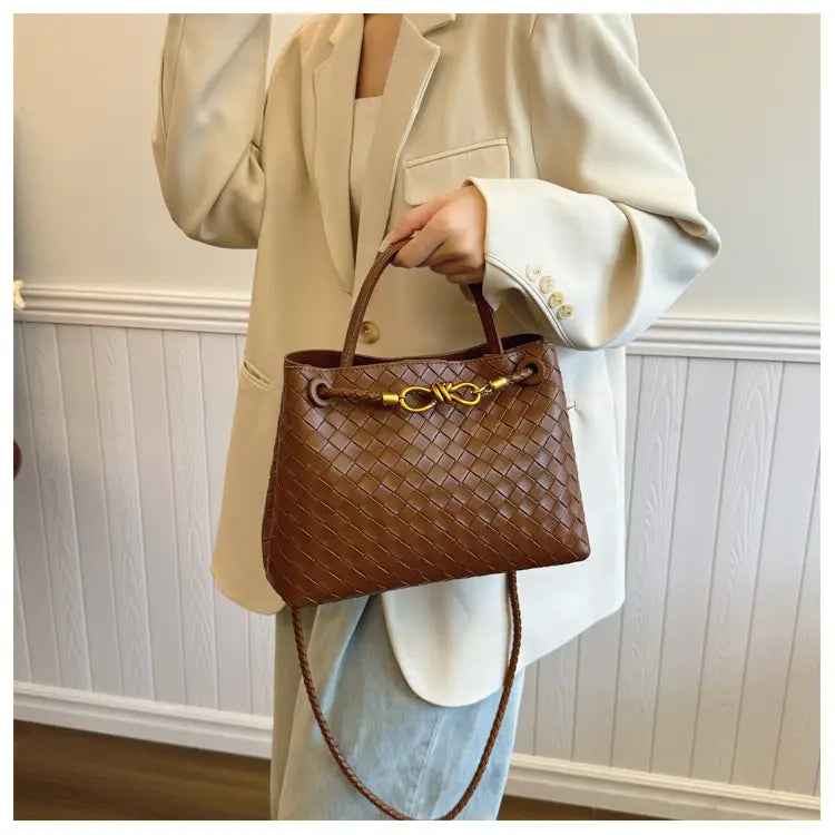 Metal rope buckle woven shoulder bag fashionable versatile retro commuter bag for women.
