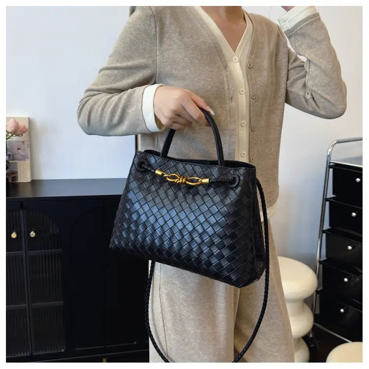 Metal rope buckle woven shoulder bag fashionable versatile retro commuter bag for women.