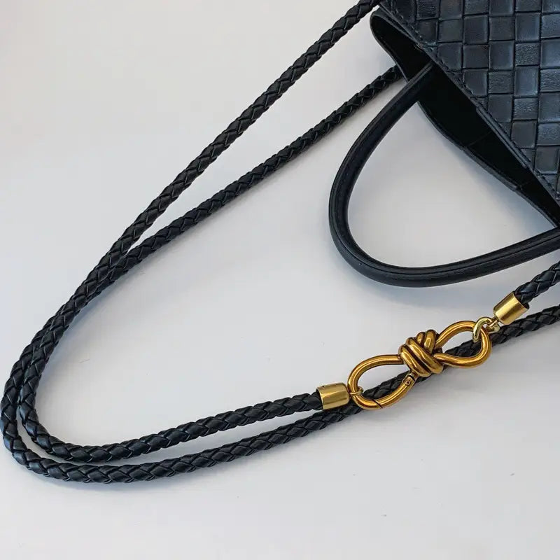 Metal rope buckle woven shoulder bag fashionable versatile retro commuter bag for women.