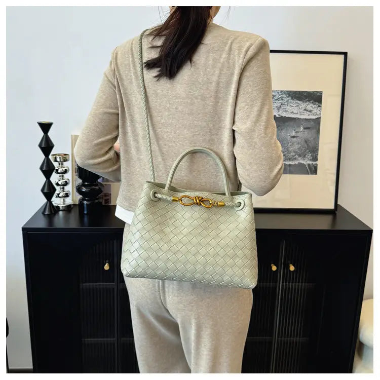 Metal rope buckle woven shoulder bag fashionable versatile retro commuter bag for women.