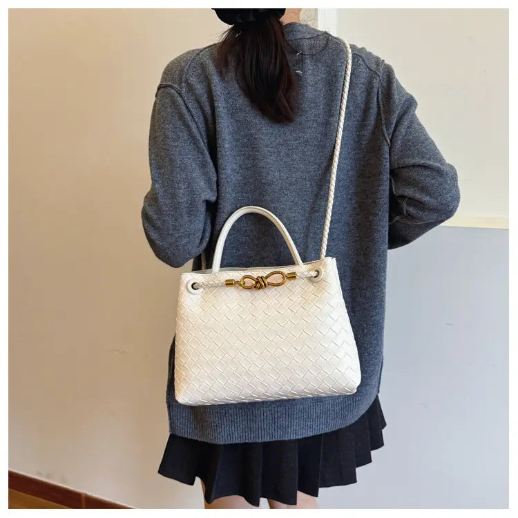 Metal rope buckle woven shoulder bag fashionable versatile retro commuter bag for women.