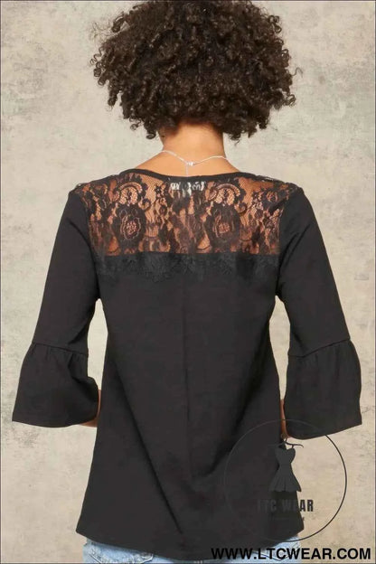 A Knit Top With Deep V Neckline And Yoke Design