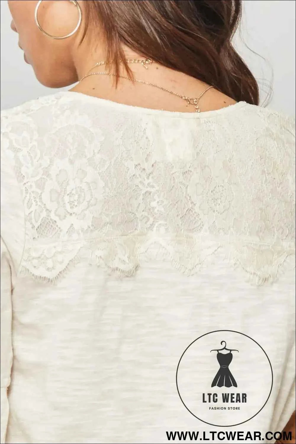 A Knit Top With Deep V Neckline And Yoke Design