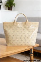 Beige eyelet flower pattern pvc glossy waterproof tote bag - beige / one size / 95% pu + 5% alloy - handbags