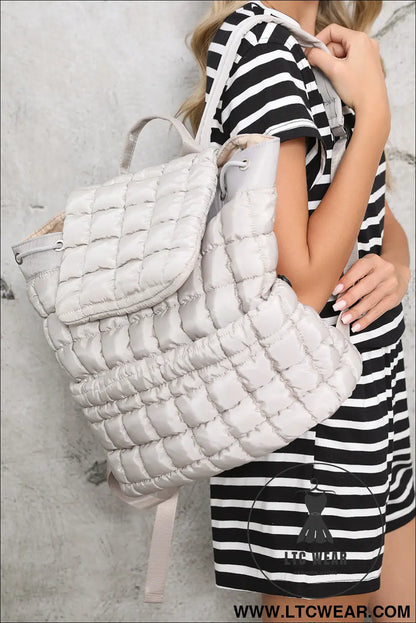 Medium grey solid flapped quilted puffer backpack - medium grey / one size / 100% polyester - backpacks