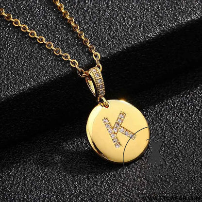 Zircon Initial Disc Necklace Collection